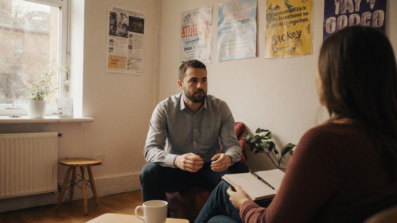 Man talking with therapist in a cozy community center, surrounded by signs for social groups and volunteer work.